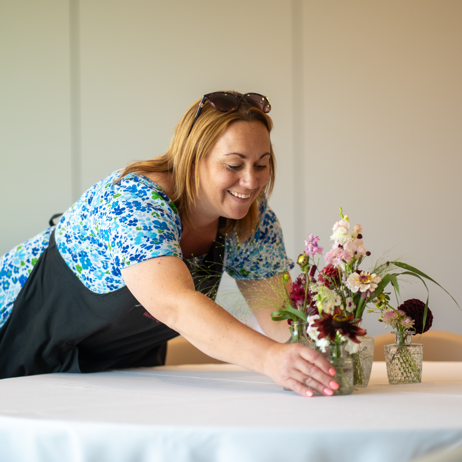 Florist arranging wedding table decorations
